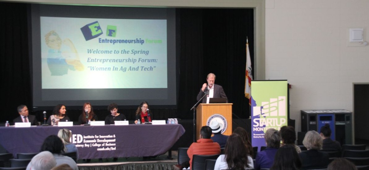 Photo of Brad Barbeau introducing panel of speakers