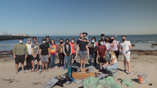 Student and friends at beach clean-up