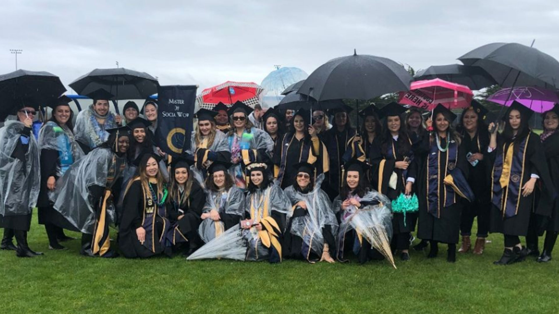 Photo: Social work graduates in the rain