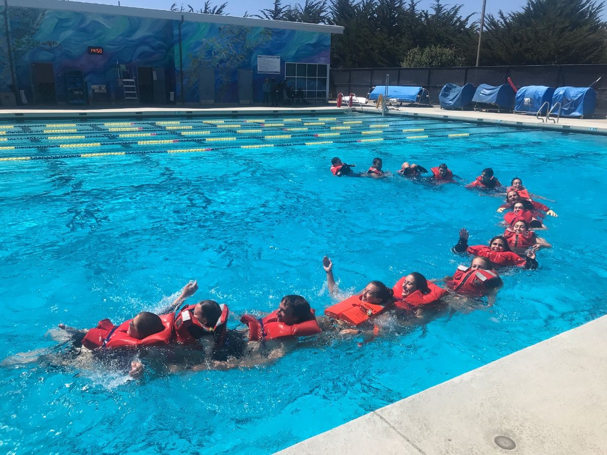 Students learning boating safety in the pool