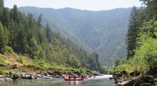 Students participate in a water rafting activity