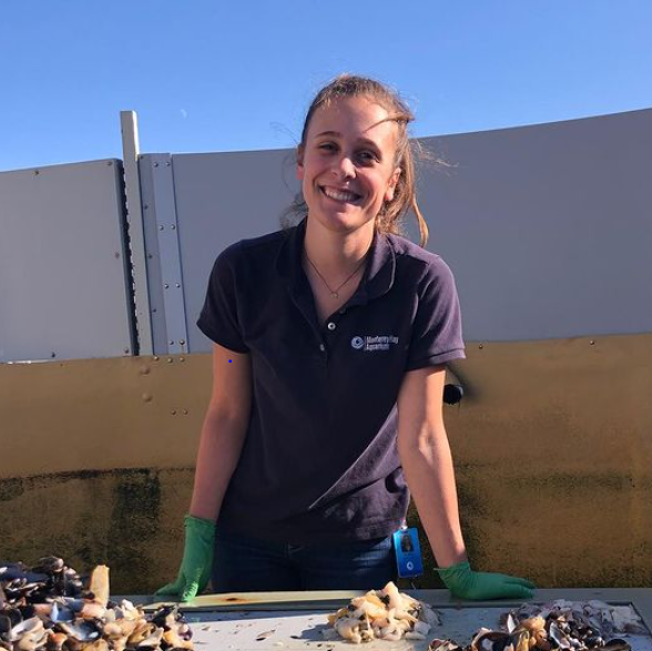 Cristina Robles-Beilby poses at her job at the Monterey Bay Aquarium