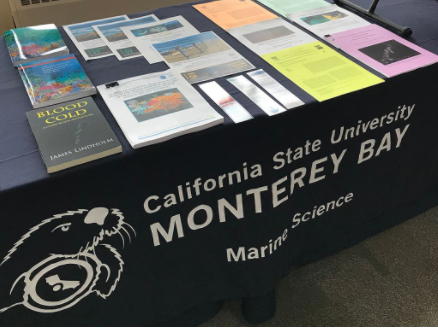 marine science events table with brochures and publications