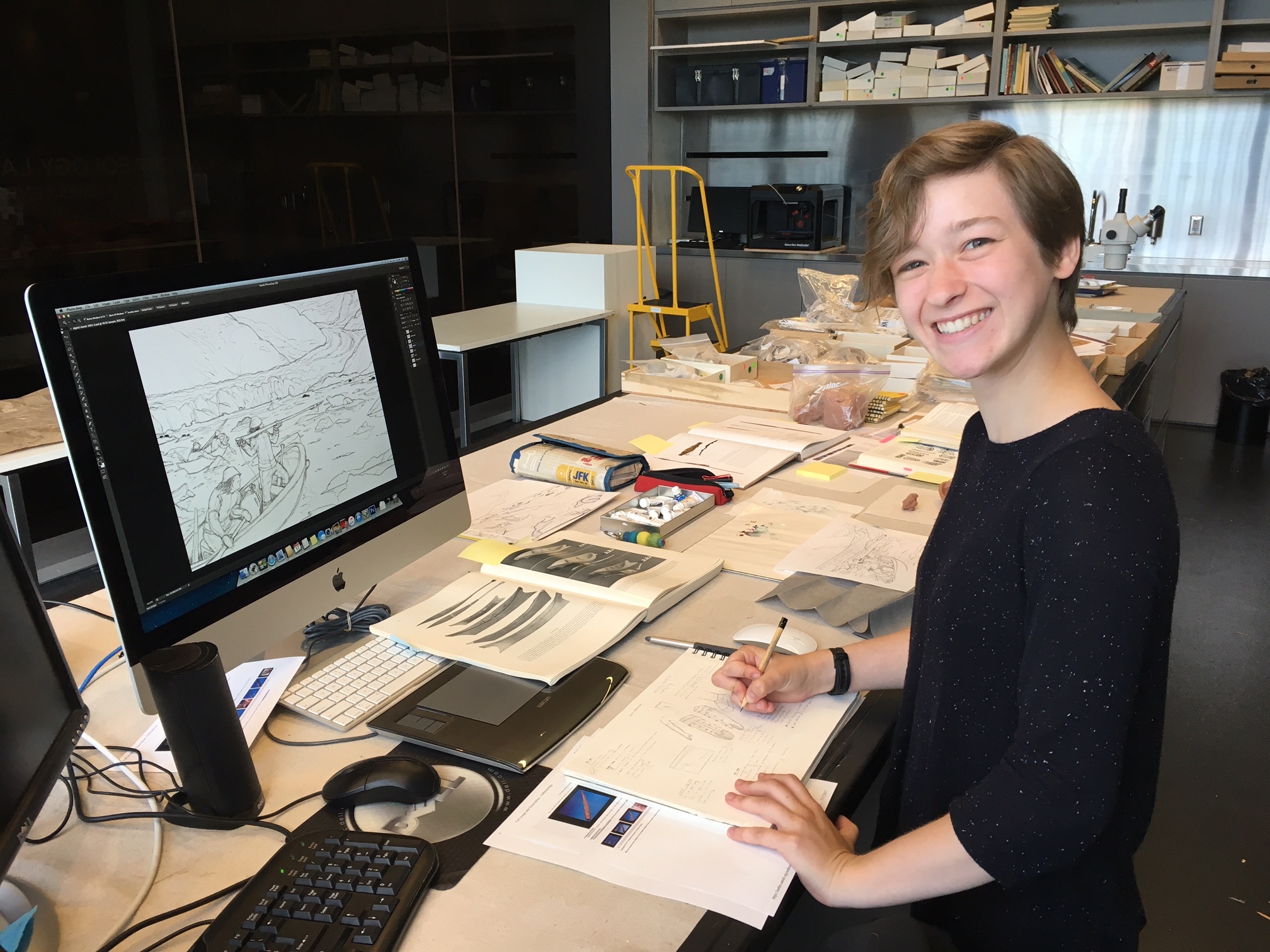 Science Illustrator Emily Kearney-Williams works at her desk at the Smithsonian Institution’s Arctic Studies Center office in Anchorage, Alaska.