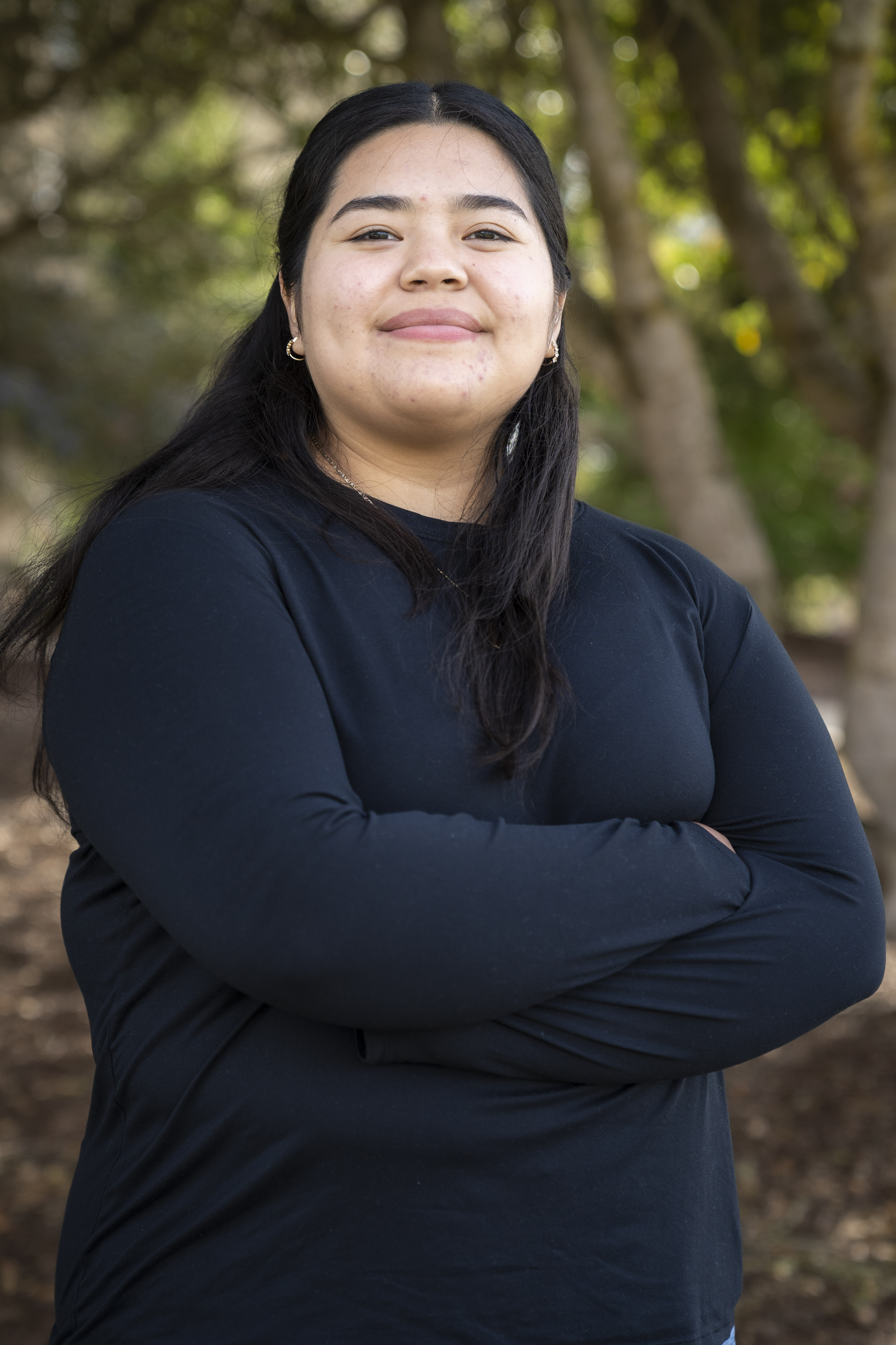 Student staff image of her folding her arms