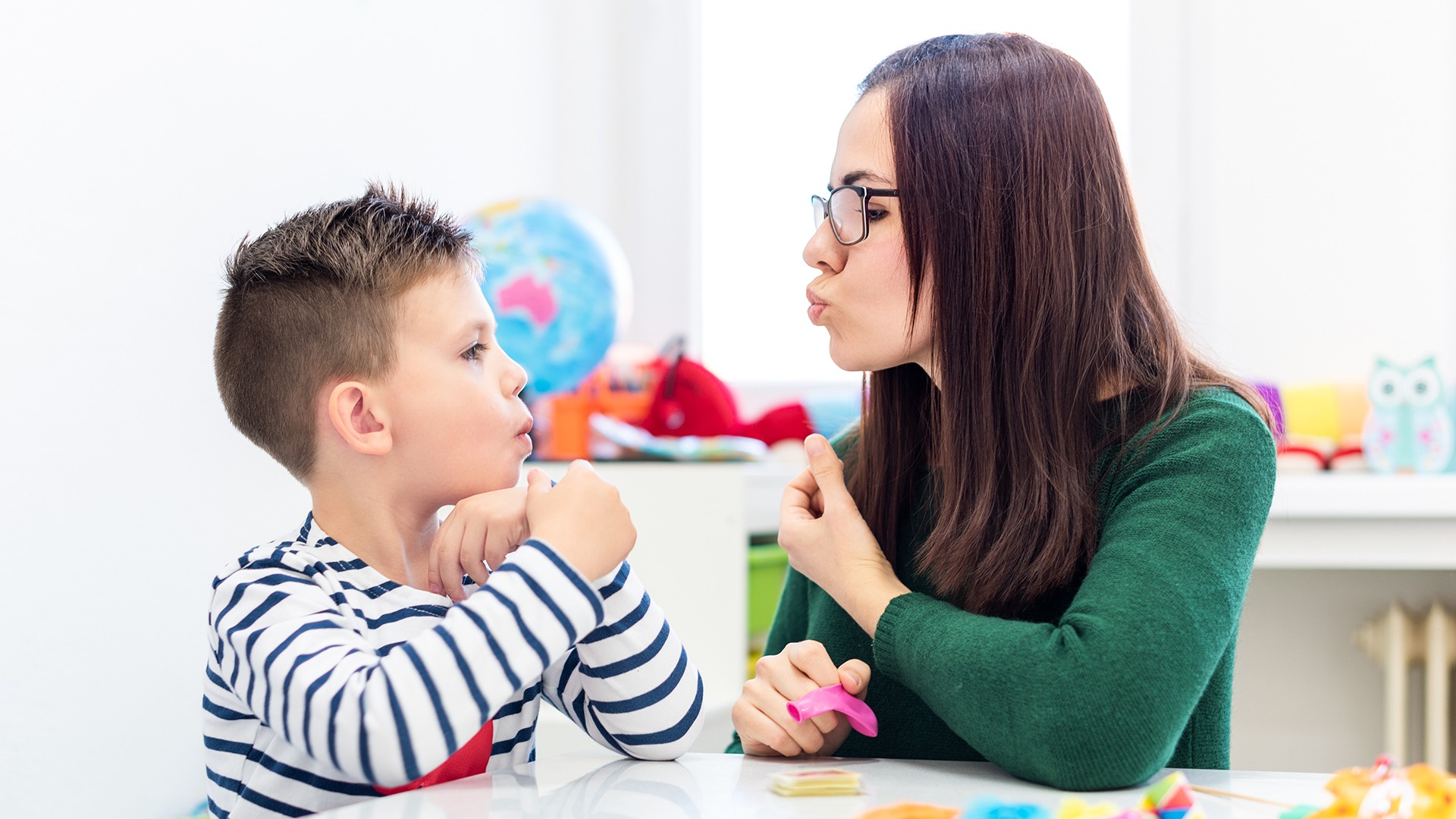 Speech-language practitioner with student