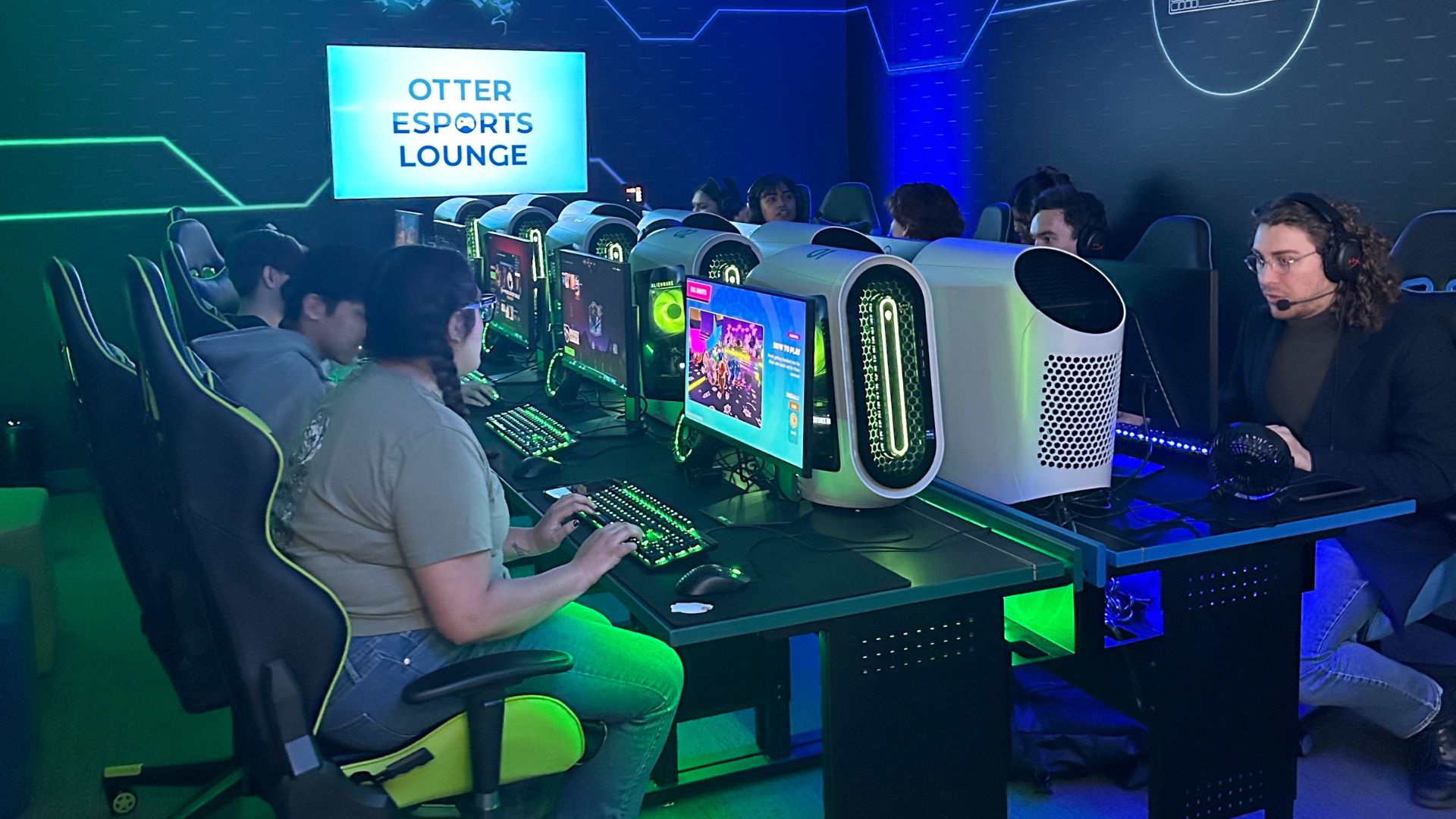 Students enjoying the newly opened Otter Esports Lounge by playing on the 10 video gaming stations