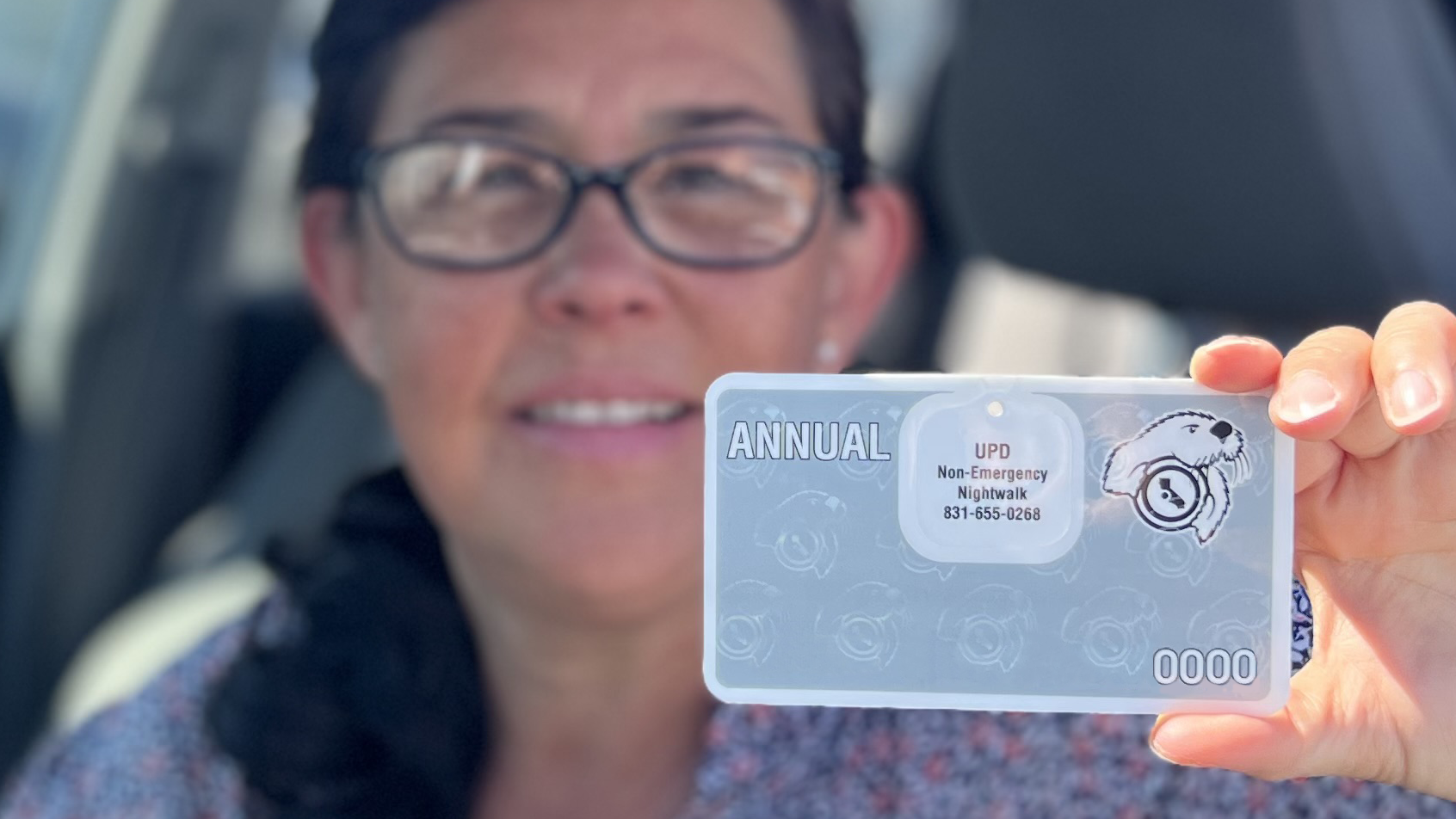 Women holding a parking permit