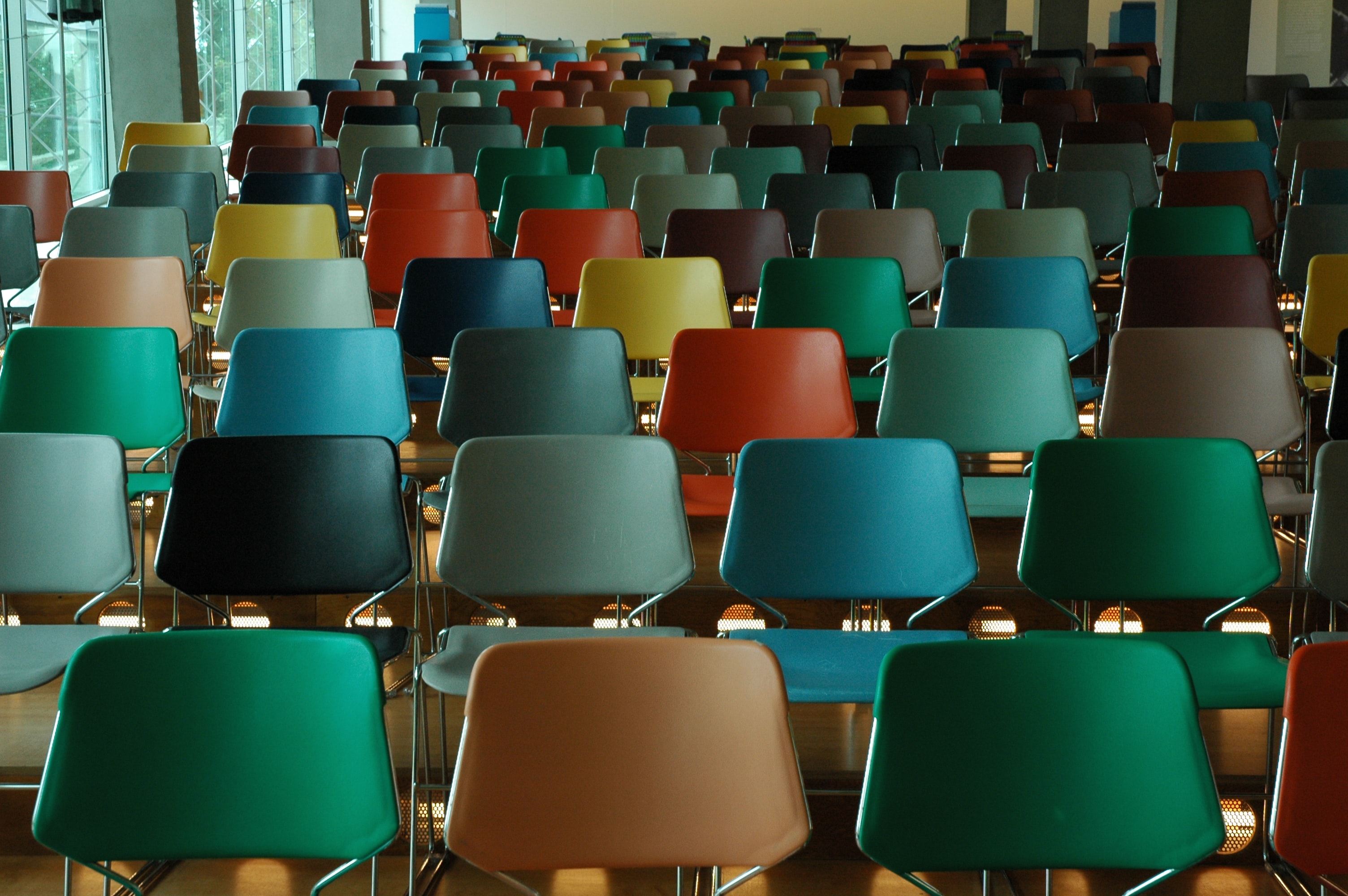 A set of chairs in a college classroom.