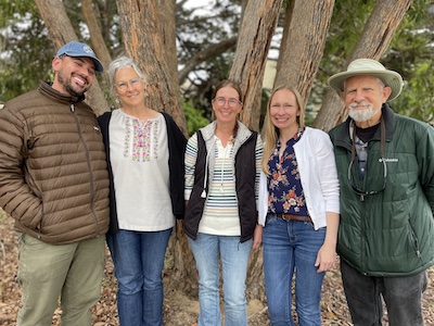 Photo of staff members of Elkhorn Slough, Hall District Elementary, and CSUMB in front of a tree.