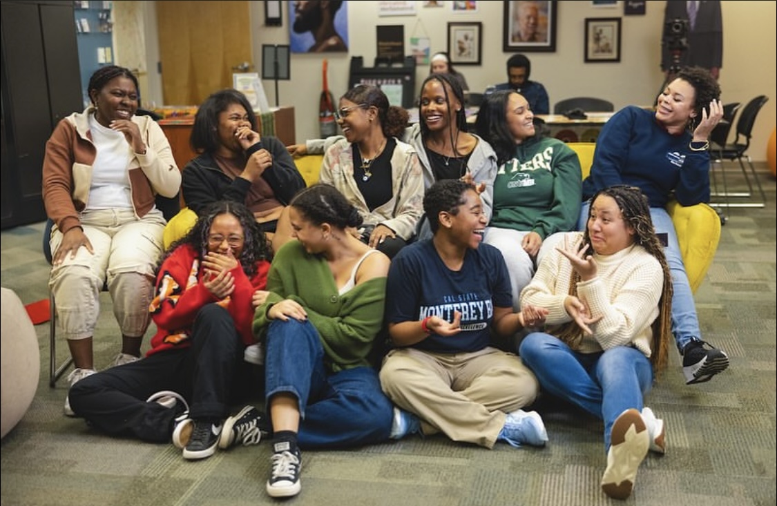 Group of students sitting together and laughing