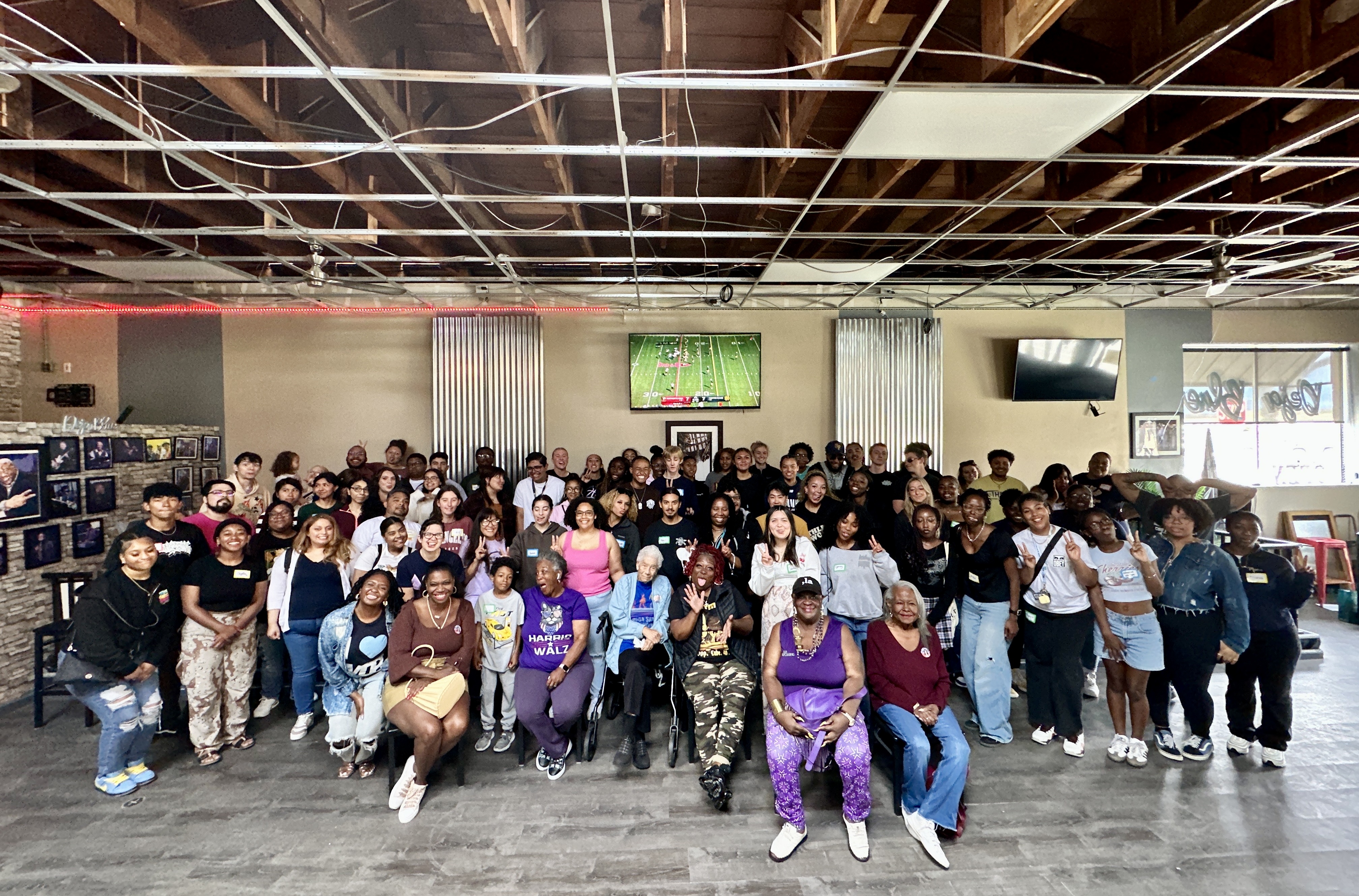 large group of people smiling for group photo