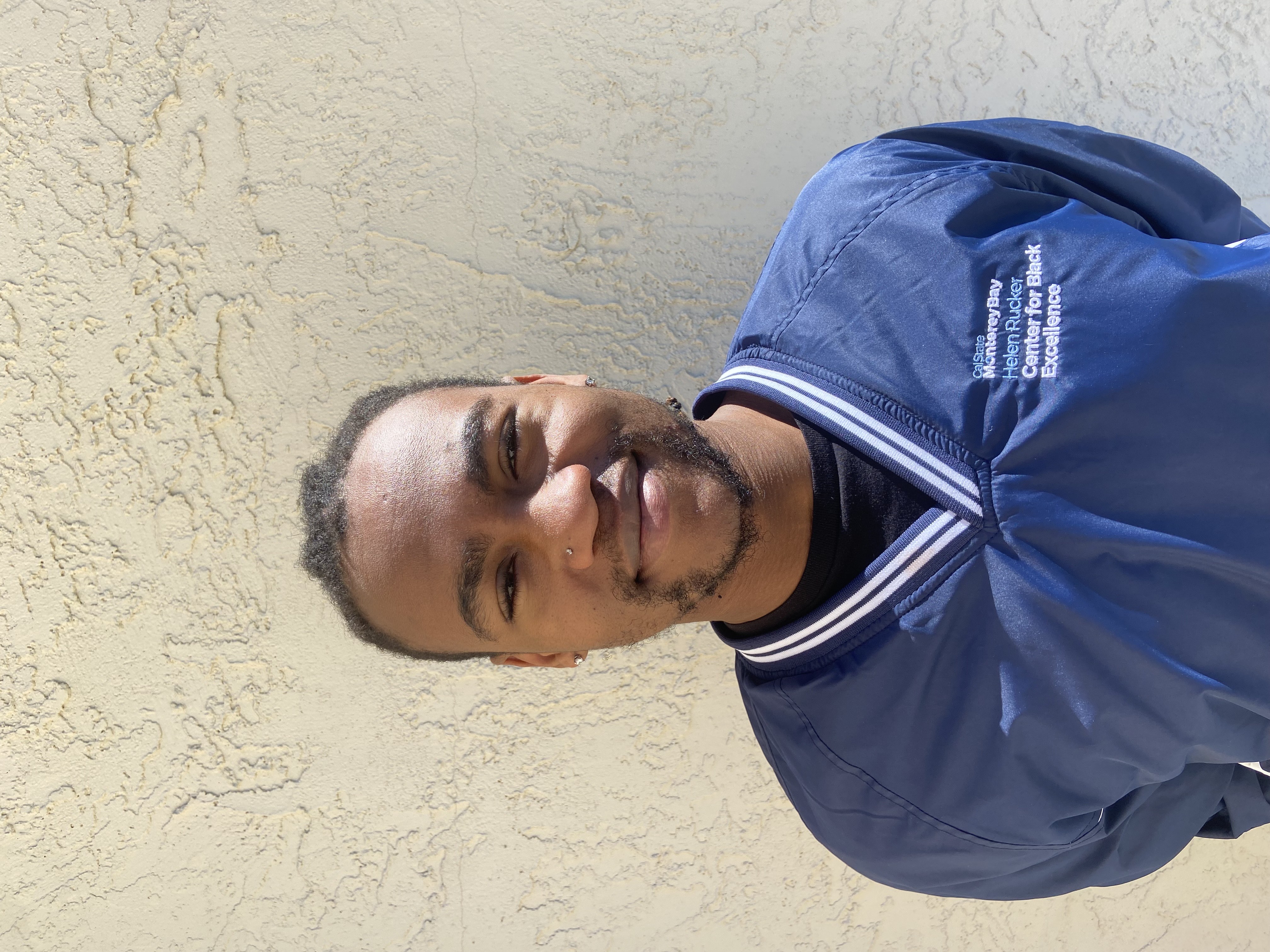 Student Coordinator wearing navy blue windbreaker