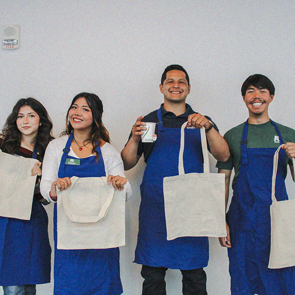 4 students holding tote bags for Totes and Tea event