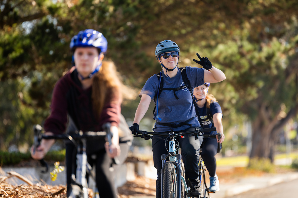 Photo of csumb students riding bikes during the final coastal ride