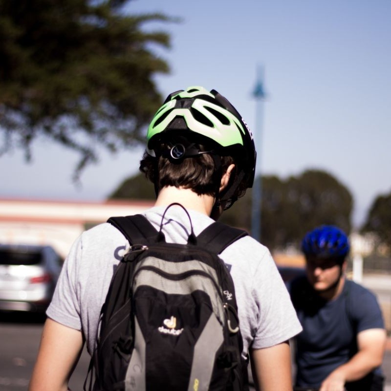 The back of student wearing a bike helmet