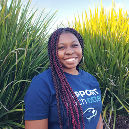 Orientation Leader smiling at camera for solo picture.