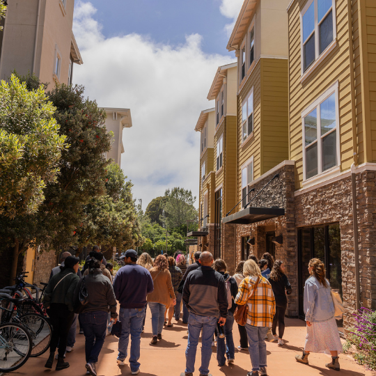 Prospect Students and Supporters walking along a path between Promontory buildings