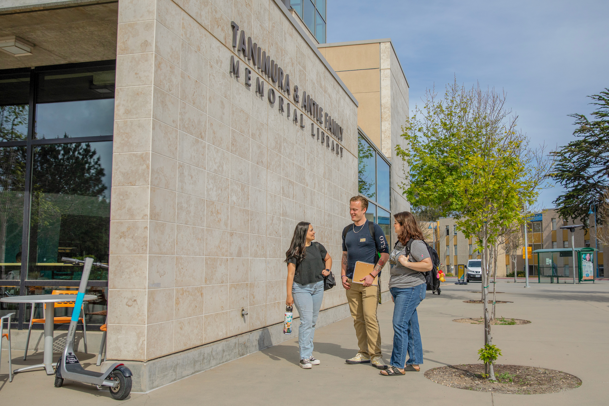 Students walking by the Library