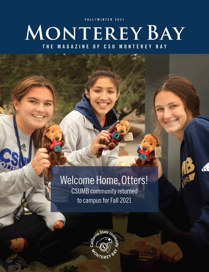 Photo: Magazine cover showing three students smiling while holding otter plushies