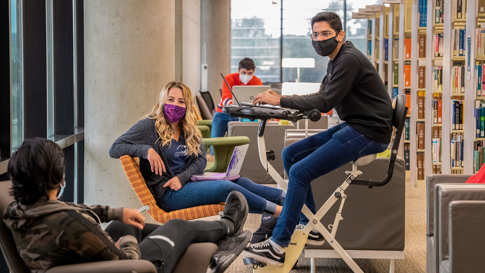 Photo: Masked students in the library