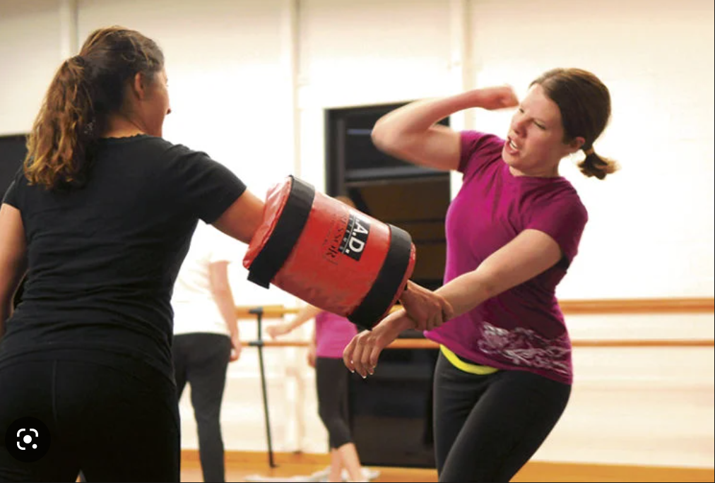 A woman learning self defense