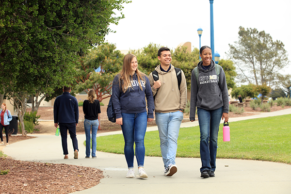 three students walking together