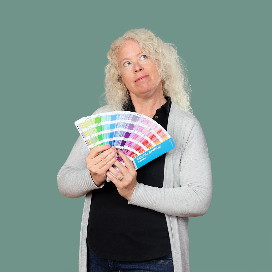 Renee holding a pantone swatch book