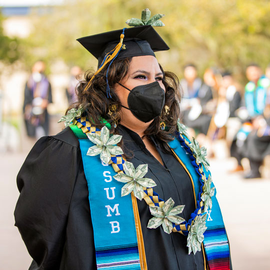 Photo: Class of 2020 graduate at the 2022 commencement