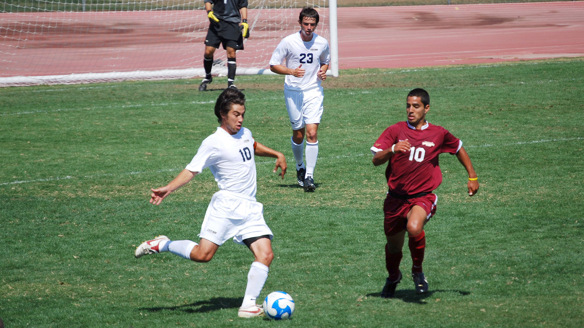 Photo: Previous CSUMB soccer player Kyle Satow about to kick a soccer ball while playing against another team