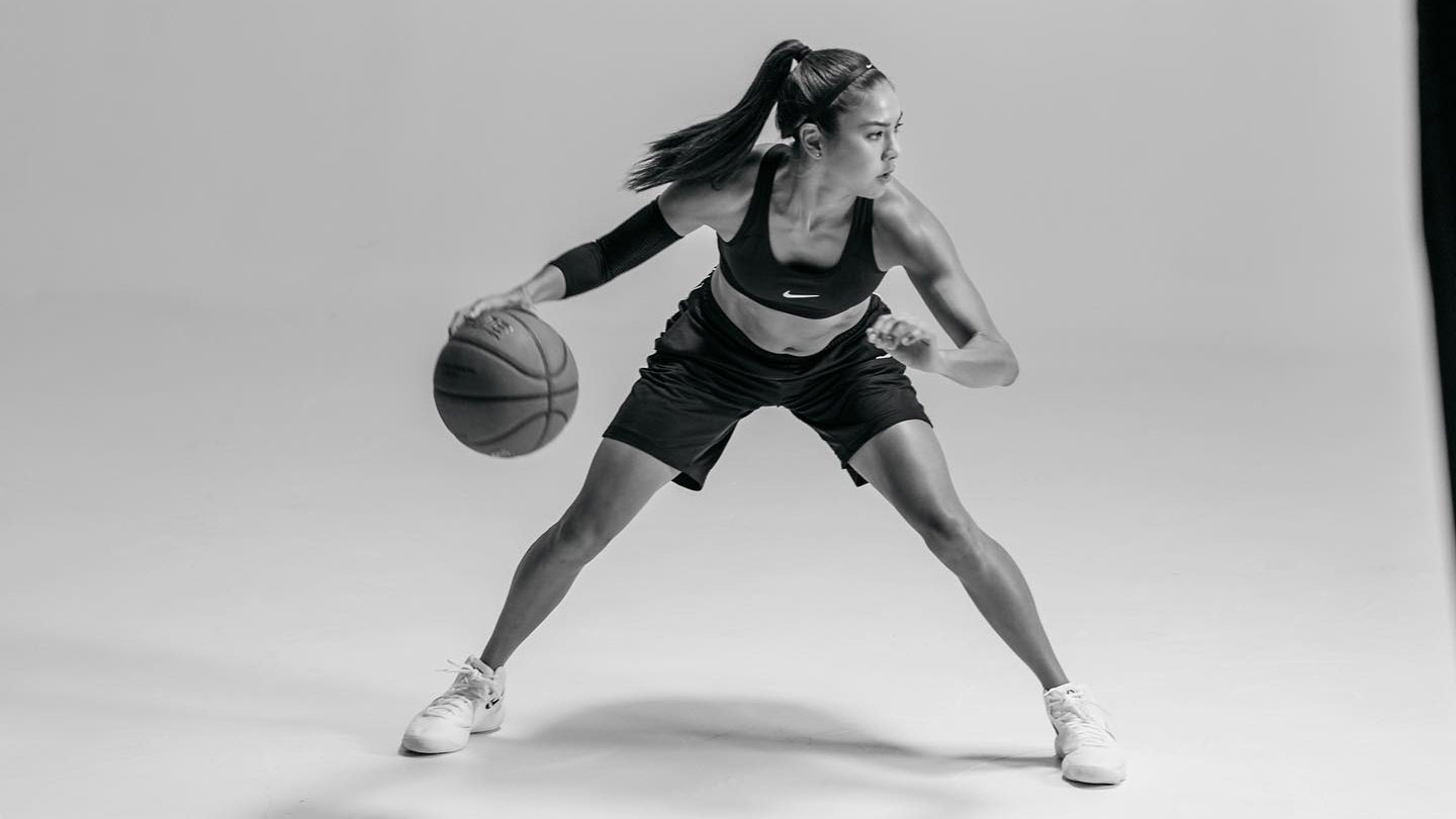 Photo: Stefanie Corgel posing in Nike gear with a basketball