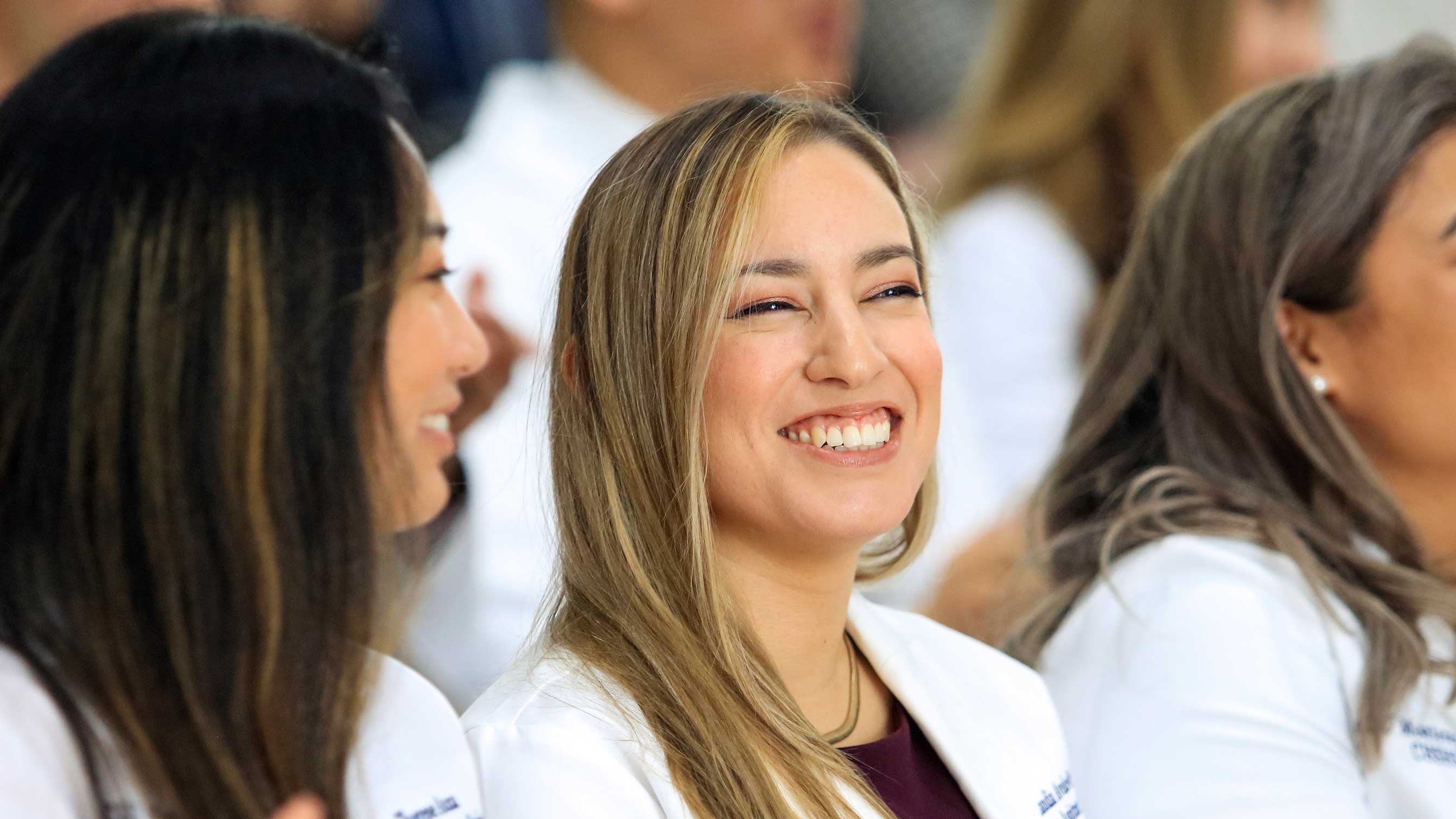 MSPA student smiling during the White Coat Ceremony