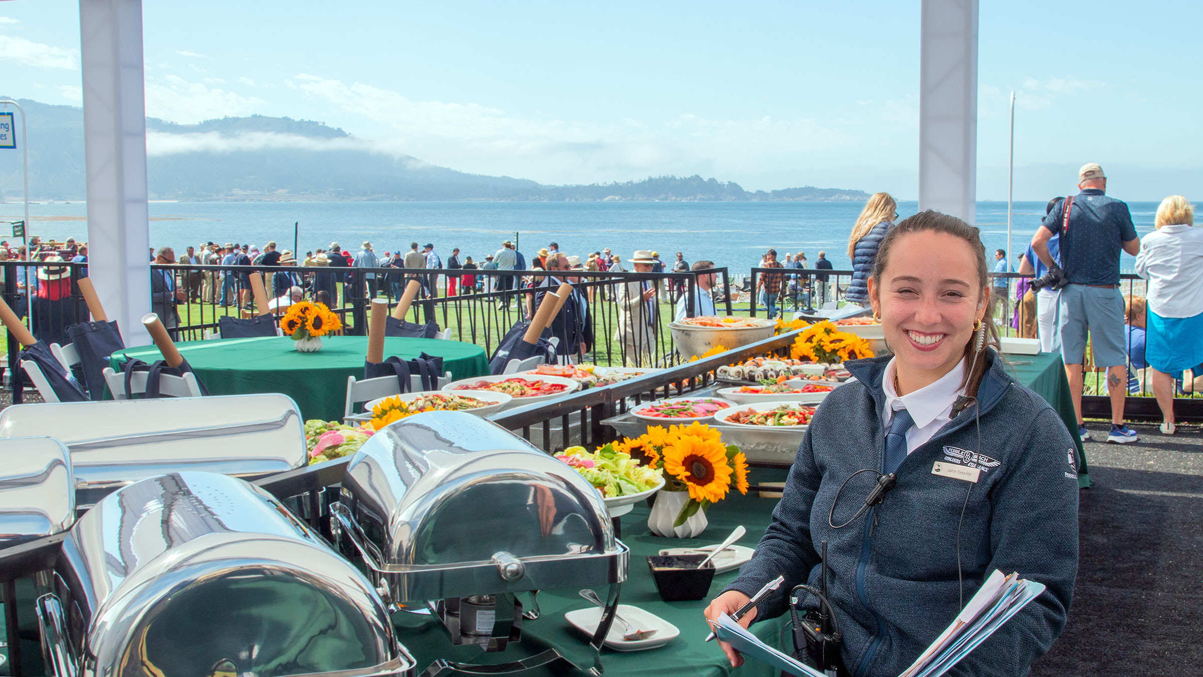 Intern Joanna Rivera-Arce manages a guest area at the 2023 Concours d'Elegance